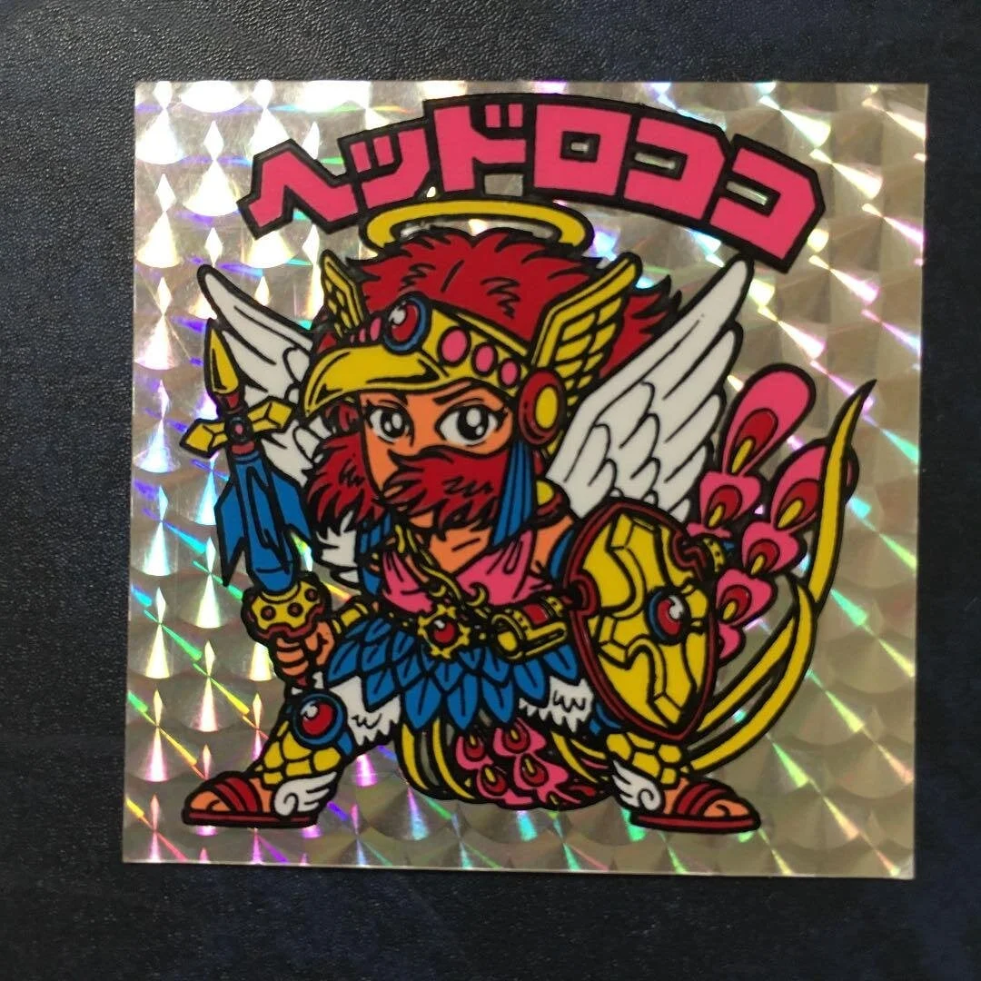 第9弾のレアシールにあたる「ヘッドロココ」。プリズム加工が逆扇のエラー品は、美品でなくても数万円で取引されている。